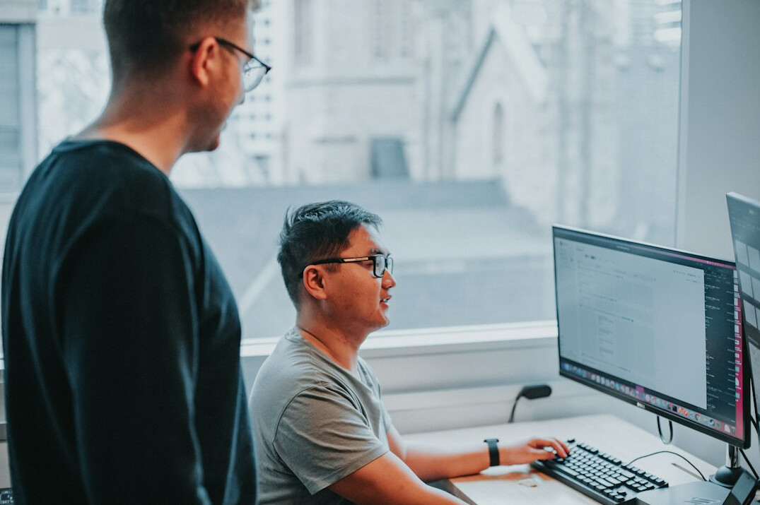 team of developers discussing code