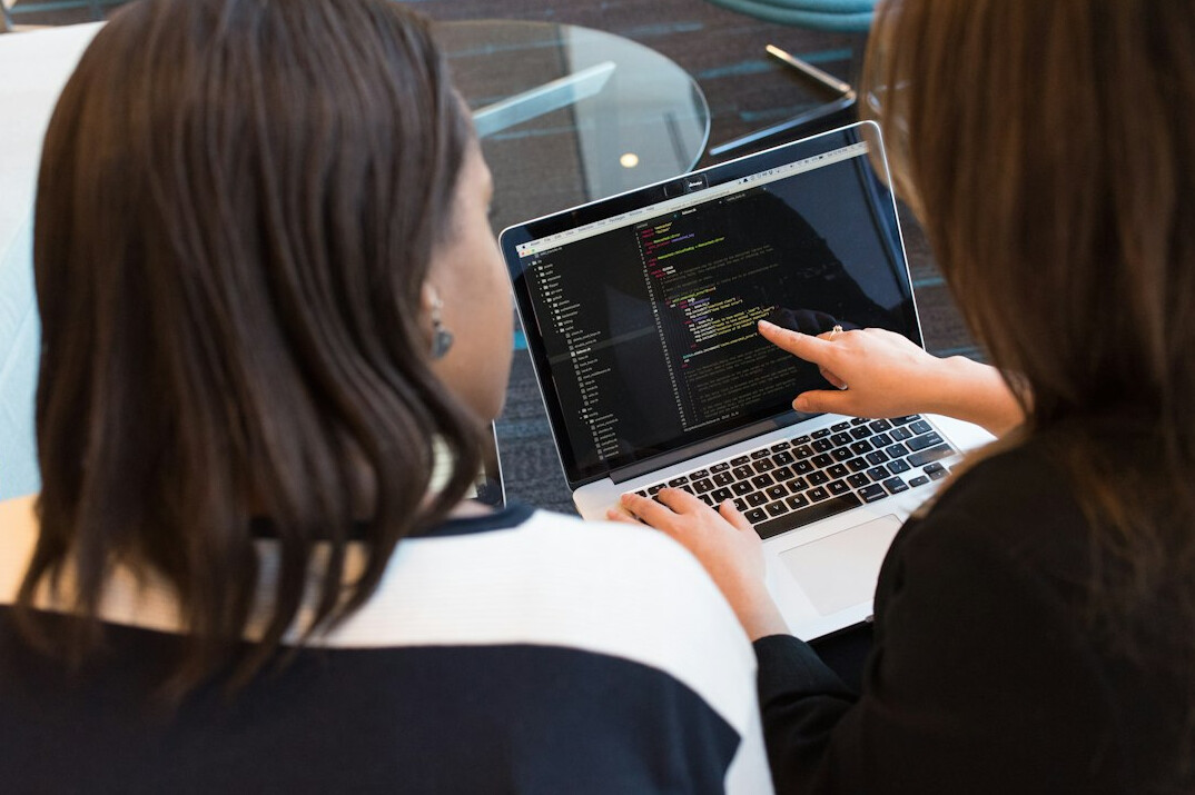 team of developers discussing code